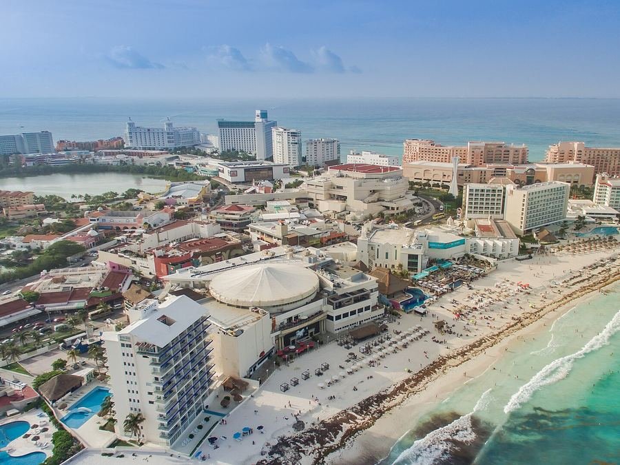 Aerial view of Cancún's Hotel Zone between the lagoon and the turquoise sea
